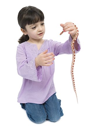 snake images for kids - Close-up of a girl holding a snake Stock Photo - Premium Royalty-Free, Code: 640-01364276