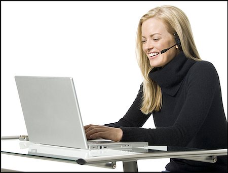 Close-up of a businesswoman working on a laptop Stock Photo - Premium Royalty-Free, Code: 640-01364277
