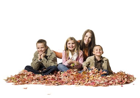 fall mother leaves - Family sitting in autumn leaves Stock Photo - Premium Royalty-Free, Code: 640-01364327