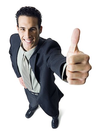 High angle view of a businessman showing a thumbs up sign Stock Photo - Premium Royalty-Free, Code: 640-01364355