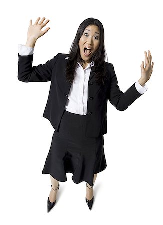 person surprised and scared full body - Businesswoman with hands up Stock Photo - Premium Royalty-Free, Code: 640-01364566