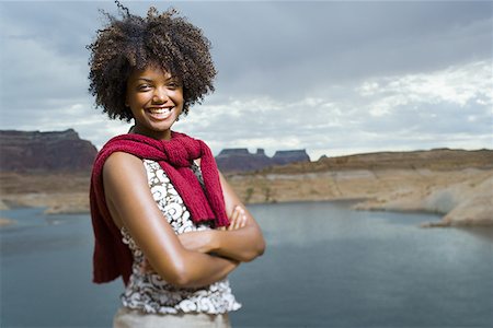 simsearch:640-01358229,k - Portrait of a young woman standing on a lakeside Stock Photo - Premium Royalty-Free, Code: 640-01364602