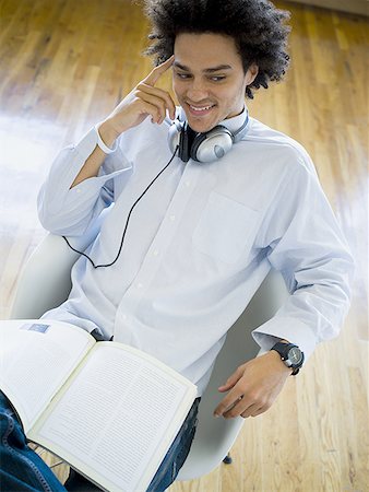 simsearch:400-04856416,k - High angle view of a young man wearing headphones Stock Photo - Premium Royalty-Free, Code: 640-01364750