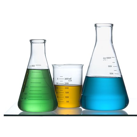 Close-up of beakers on a table in a laboratory with colored liquid Stock Photo - Premium Royalty-Free, Code: 640-01364751