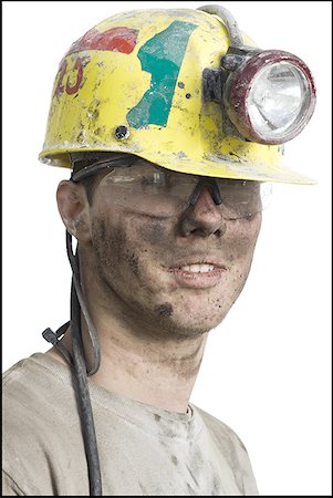 Portrait of a coal miner wearing a hardhat Stock Photo - Premium Royalty-Free, Code: 640-01364764