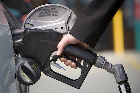 simsearch:6105-05395912,k - Close-up of a woman's hand refueling her car Stock Photo - Premium Royalty-Free, Code: 640-01364932