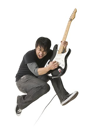 simsearch:640-01365707,k - Young man playing an electric guitar Stock Photo - Premium Royalty-Free, Code: 640-01364942