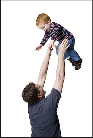 simsearch:640-01354837,k - Profile of a father catching his son Stock Photo - Premium Royalty-Free, Code: 640-01364950
