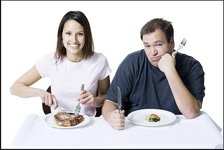 simsearch:640-01350815,k - Portrait of a young couple sitting at the table Stock Photo - Premium Royalty-Free, Code: 640-01364988