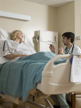 Female patient listening to a male doctor Stock Photo - Premium Royalty-Free, Code: 640-01365039