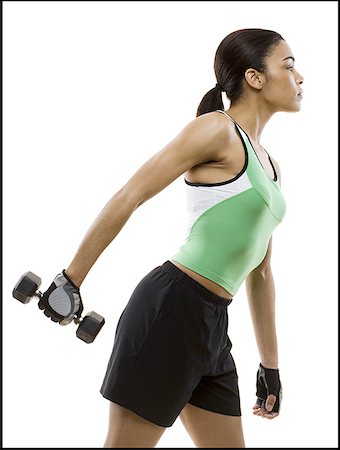 simsearch:640-01361005,k - Profile of a young woman exercising with a dumbbell Stock Photo - Premium Royalty-Free, Code: 640-01365350