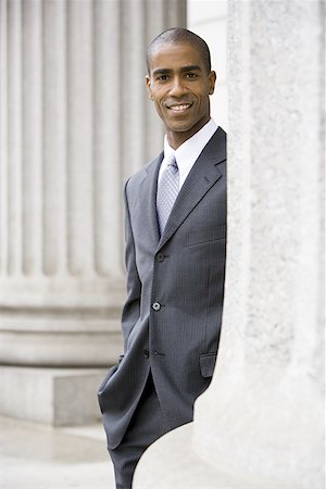simsearch:640-02767805,k - Portrait of a male lawyer standing in front of a courthouse and smiling Stock Photo - Premium Royalty-Free, Code: 640-01365436