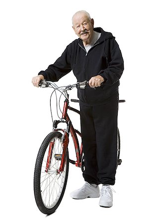 Older man with a tandem bicycle Stock Photo - Premium Royalty-Free, Code: 640-01365558
