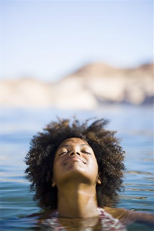 simsearch:640-01358229,k - Close-up of a young woman swimming in a lake Stock Photo - Premium Royalty-Free, Code: 640-01365615