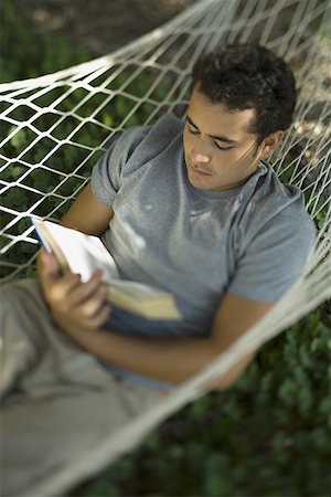 simsearch:640-01361005,k - High angle view of a young man reading a book in a hammock Stock Photo - Premium Royalty-Free, Code: 640-01365633