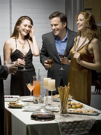 simsearch:640-01350537,k - People laughing at a party Stock Photo - Premium Royalty-Free, Code: 640-01365652