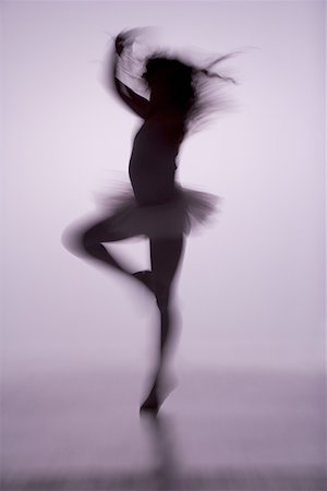preteen dancing - Side profile of a ballerina dancing Stock Photo - Premium Royalty-Free, Code: 640-01365735