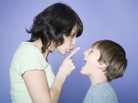 punishment - Profile of a mother scolding her son Stock Photo - Premium Royalty-Free, Code: 640-01365791
