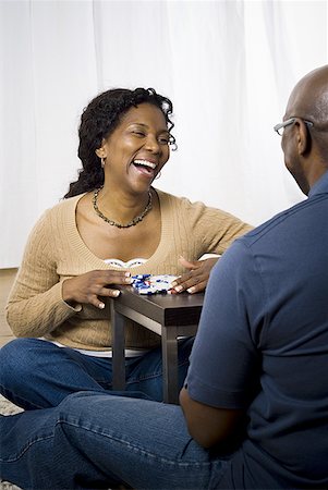 Close-up of a mature couple sitting face to face and smiling Stock Photo - Premium Royalty-Free, Code: 640-01365816