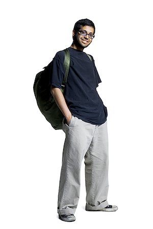 Young man standing with hands in his pockets Stock Photo - Premium Royalty-Free, Code: 640-01365983