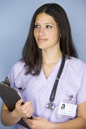 simsearch:640-01364042,k - Close-up of a female nurse holding a clipboard Stock Photo - Premium Royalty-Free, Code: 640-01366039