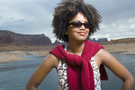 simsearch:640-01358229,k - Close-up of a young woman standing on a lakeside Stock Photo - Premium Royalty-Free, Code: 640-01366094