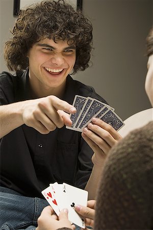 face card - Gros plan des cartes à jouer deux adolescents et souriant Photographie de stock - Premium Libres de Droits, Code: 640-01366248