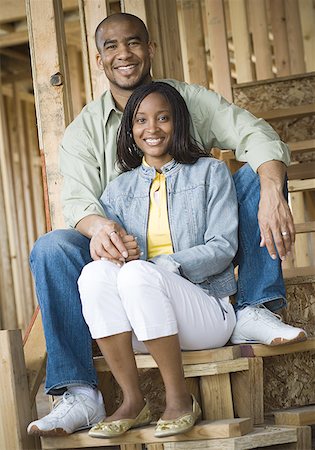 simsearch:640-02764709,k - Portrait of a young couple sitting on a staircase and smiling Stock Photo - Premium Royalty-Free, Code: 640-01366372