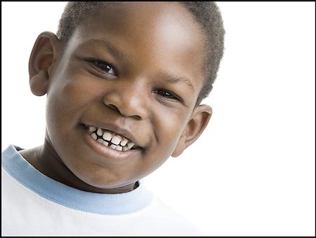 Portrait of a boy smiling Stock Photo - Premium Royalty-Free, Code: 640-01366416