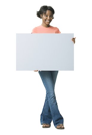 Portrait of a young woman holding a blank sign Stock Photo - Premium Royalty-Free, Code: 640-01360065