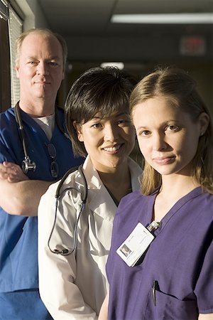 security identification - Portrait of a female doctor with two nurses Stock Photo - Premium Royalty-Free, Code: 640-01360115