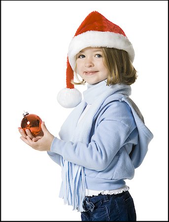 Portrait of a girl holding a Christmas ball Stock Photo - Premium Royalty-Free, Code: 640-01360141