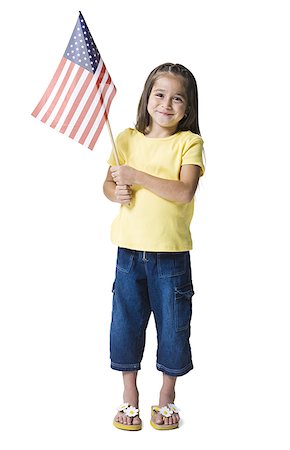 Portrait d'une jeune fille tenant un drapeau américain Photographie de stock - Premium Libres de Droits, Code: 640-01360328