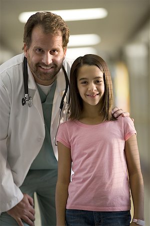 friend console - Portrait of a girl standing with a male doctor Stock Photo - Premium Royalty-Free, Code: 640-01360323