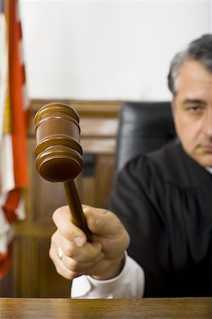 simsearch:640-01351636,k - Close-up of a male judge hitting a gavel on the bench Stock Photo - Premium Royalty-Free, Code: 640-01360674