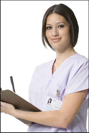 simsearch:640-01364042,k - Portrait of a nurse making a report Stock Photo - Premium Royalty-Free, Code: 640-01360729