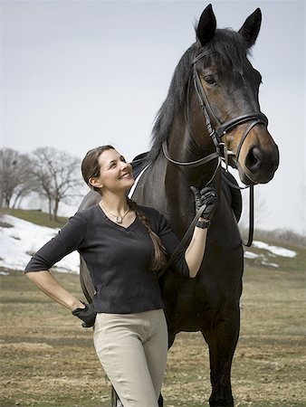 Woman standing with a horse Foto de stock - Sin royalties Premium, Código: 640-01360879