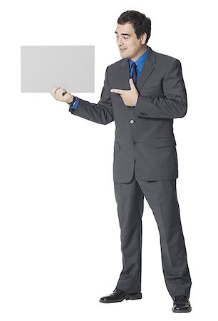 Businessman holding a blank sign Stock Photo - Premium Royalty-Free, Code: 640-01360917