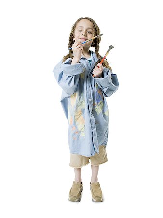 simsearch:640-01357979,k - Portrait of a girl holding two paintbrushes Stock Photo - Premium Royalty-Free, Code: 640-01361019