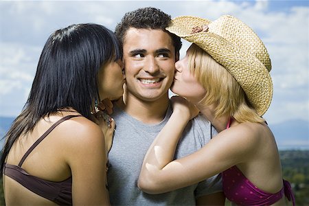 simsearch:640-01350537,k - Close-up of two young women kissing a young man Stock Photo - Premium Royalty-Free, Code: 640-01361052