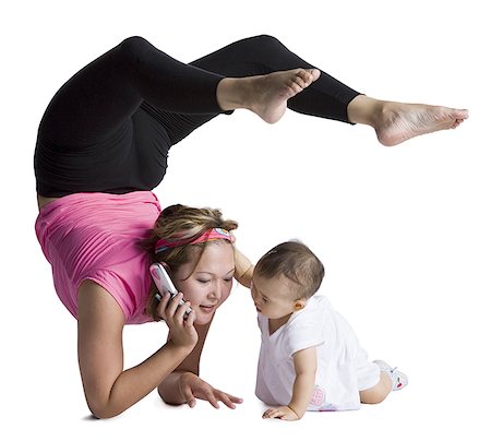 silhouette of woman bending backwards - Contortionist mother with baby daughter Stock Photo - Premium Royalty-Free, Code: 640-01361060