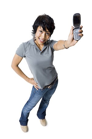simsearch:640-03260747,k - Woman holding up a cell phone Stock Photo - Premium Royalty-Free, Code: 640-01361129