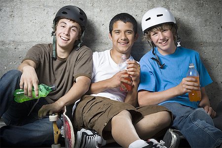 Portrait of three teenage boys smiling Stock Photo - Premium Royalty-Free, Code: 640-01361123