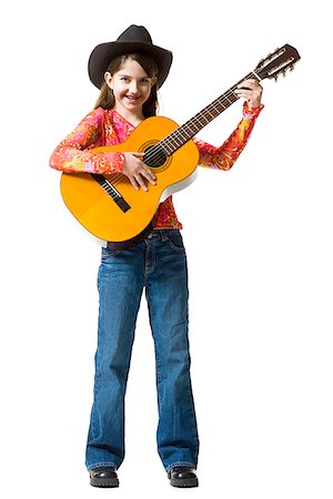 Portrait of a teenage girl playing the guitar Stock Photo - Premium Royalty-Free, Code: 640-01361160
