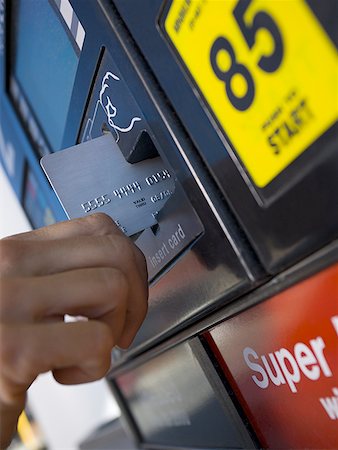 simsearch:400-06858518,k - Close-up of a person paying for gas with a credit card Stock Photo - Premium Royalty-Free, Code: 640-01361387