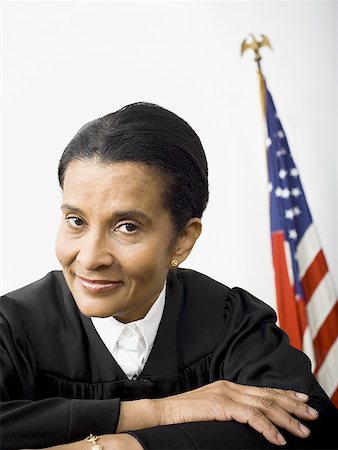 simsearch:640-01350504,k - Portrait of a female judge smiling Foto de stock - Sin royalties Premium, Código: 640-01361622