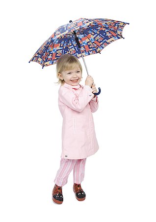 simsearch:640-01351381,k - Gros plan d'une jeune fille tenant un parapluie Photographie de stock - Premium Libres de Droits, Code: 640-01361639