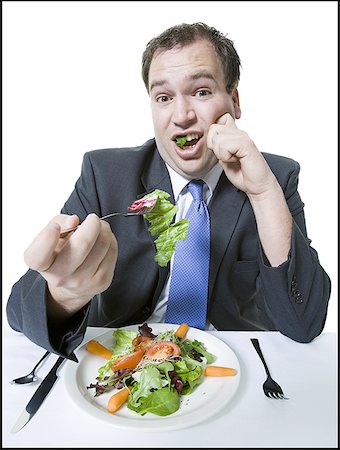 simsearch:640-01350815,k - Portrait of a young man eating a vegetable salad Stock Photo - Premium Royalty-Free, Code: 640-01361806