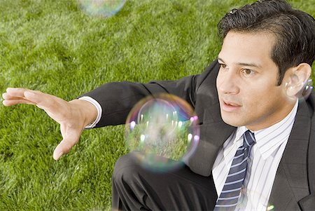 simsearch:640-01350815,k - High angle view of a businessman reaching for a soap bubble Stock Photo - Premium Royalty-Free, Code: 640-01362247