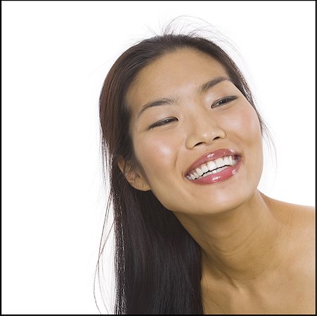 Gros plan d'une femme souriante Photographie de stock - Premium Libres de Droits, Code: 640-01362390
